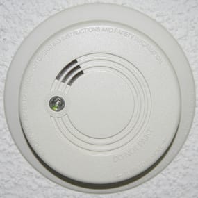 a smoke detector mounted on a ceiling